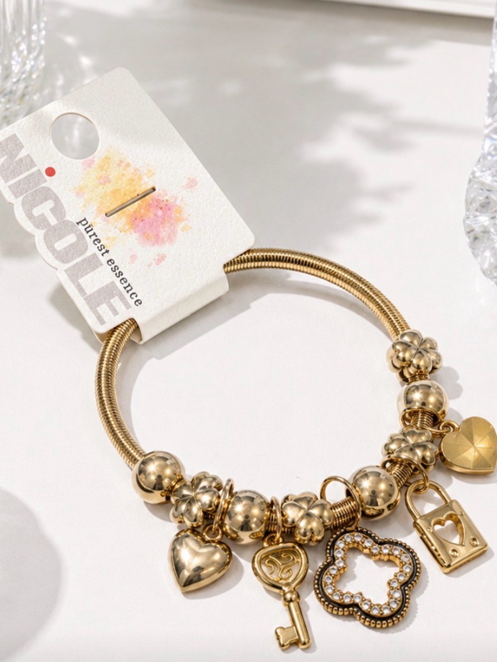 Nicole Gold-Tone Charm Bracelet with Heart, Key, Clover & Lock Charms